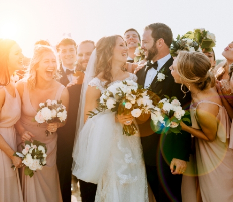 wedding party laughing with bride and groom | LaRuche Photo